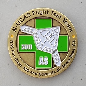 Custom Business Challenge Coin for N-UCAS FLIGHT TEST TEAM, side 1. Features and context: Business Challenge Coin, Corporate Coin, Contractor.