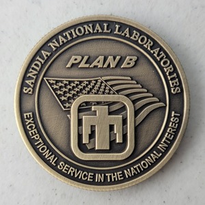 Custom Business Challenge Coin for PLAN B - DETS - SNL, side 2. Verified details: PLAN B - DYNAMIC EXPLOSIVE TEST SITE (DETS) - SNL - Challenge Coin, 1.75", Antique Gold, 3D - 1 side, Reeded Edge. Features and context: Business Challenge Coin, Corporate Coin, DETS, NUCLEAR, SNL, Contractor.