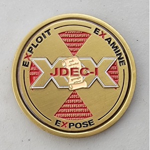 Custom Organization Challenge Coin for JDEC-I, side 1. Verified details: Two Tone Plated. Features and context: Organization Challenge Coin, GOV, Organization, Two Tone, Two Tone Plated.